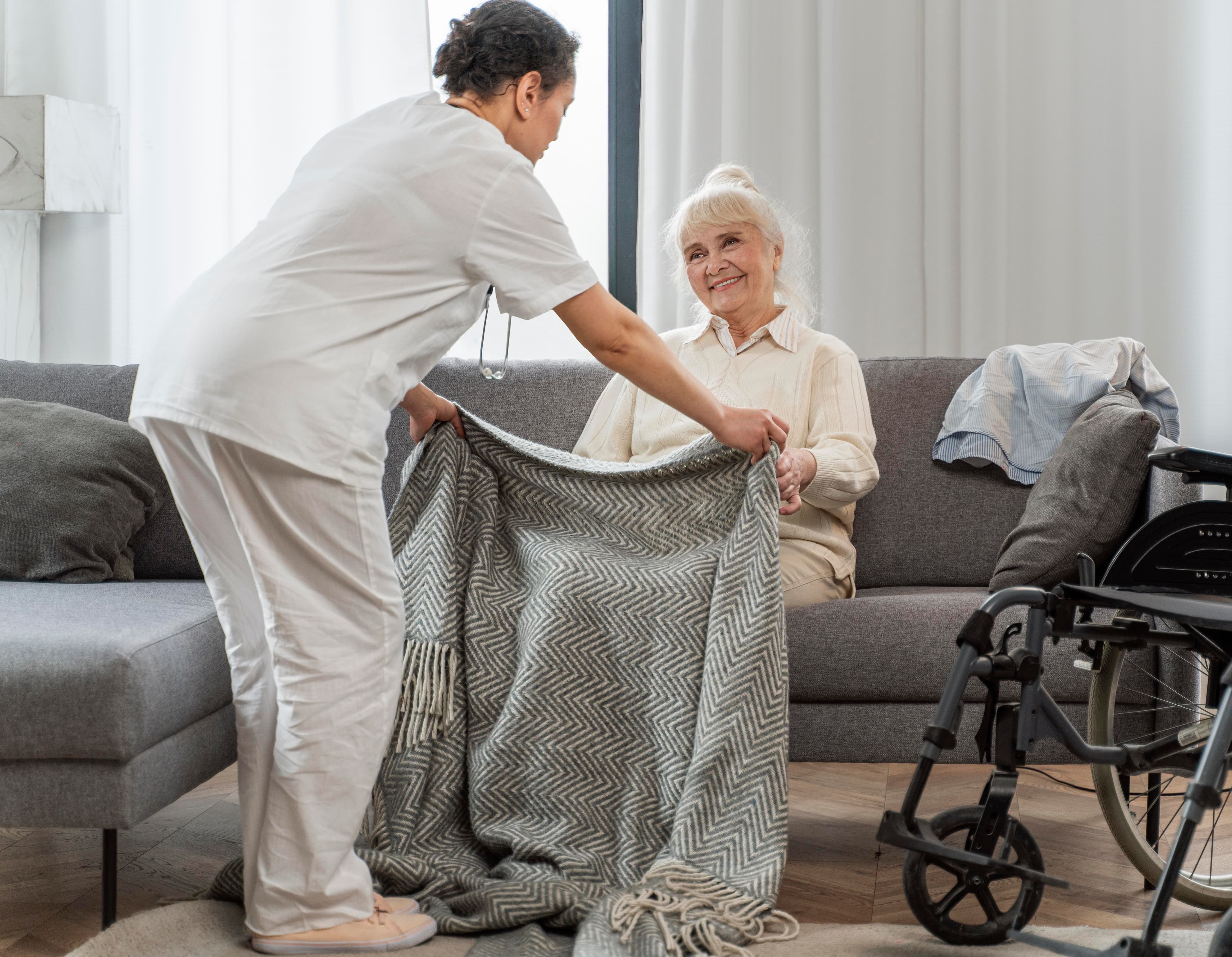 Support worker assisting participant with in-home care